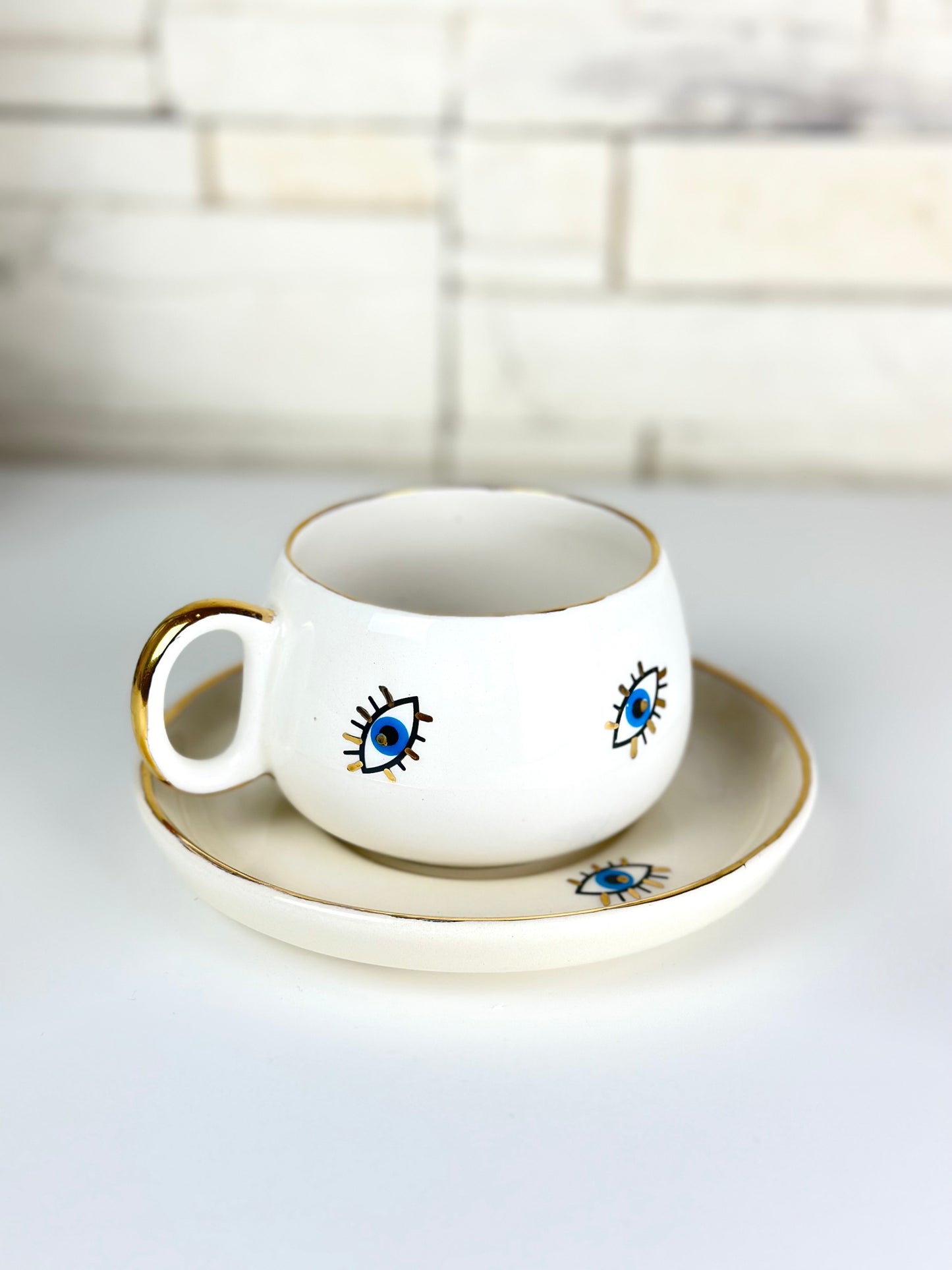 Keramiktasse mit Untersetzer little Evil Eye verziert mit 24 Karat Gold